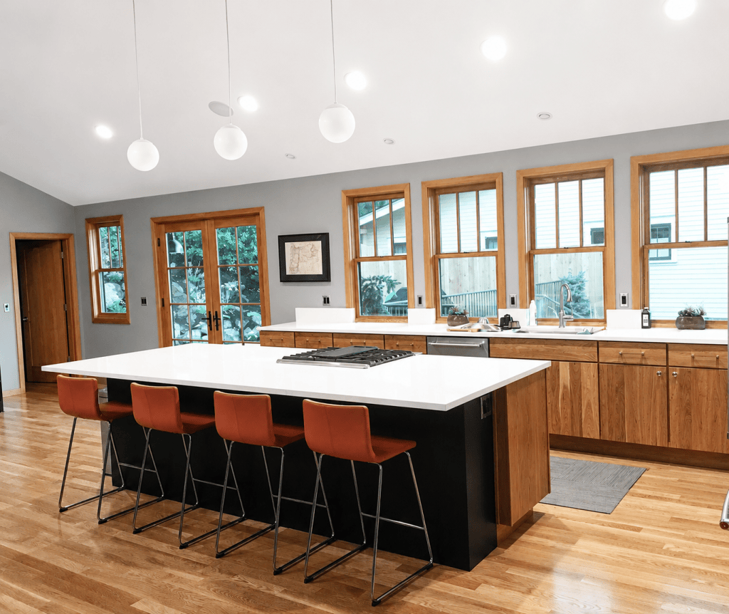 Renovated kitchen with updated cabinetry, countertops, backsplash, and modern finishes